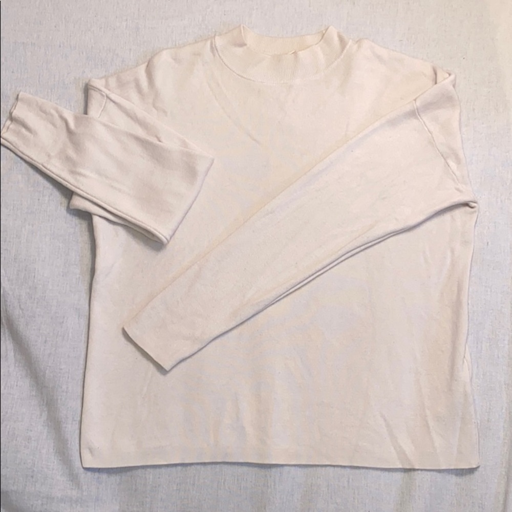 Cream crew neck sweater: slightly cropped